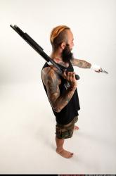 edgar-standing-aiming-shotgun-pistol