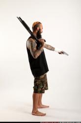 edgar-standing-aiming-shotgun-pistol