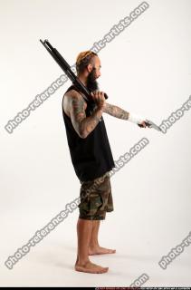 2016 12 EDGAR STANDING AIMING SHOTGUN PISTOL 05 B