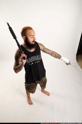 edgar-standing-aiming-shotgun-pistol