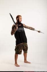 edgar-standing-aiming-shotgun-pistol