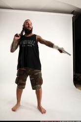 edgar-standing-aiming-shotgun-pistol