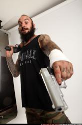 edgar-standing-aiming-shotgun-pistol