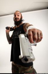 edgar-standing-aiming-shotgun-pistol