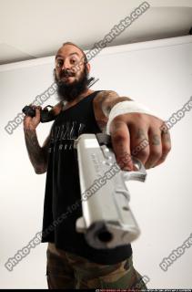 edgar-standing-aiming-shotgun-pistol