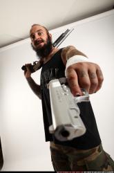 edgar-standing-aiming-shotgun-pistol