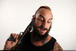 edgar-standing-aiming-shotgun-pistol