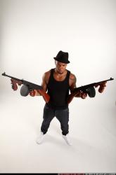Ron-tommyguns-pose1