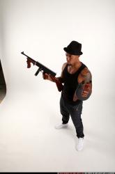 Ron-tommyguns-pose1