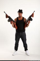 Ron-tommyguns-pose1