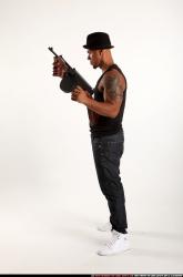 Ron-tommyguns-pose1