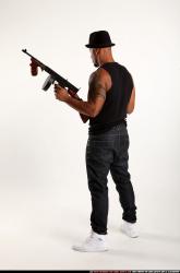 Ron-tommyguns-pose1
