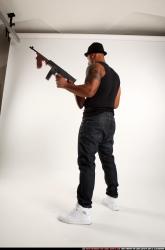 Ron-tommyguns-pose1