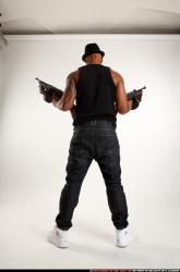 Ron-tommyguns-pose1