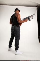 Ron-tommyguns-pose1
