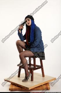 dolores-sitting-pistol-pose