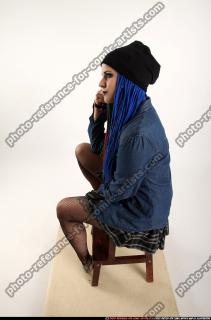 dolores-sitting-pistol-pose