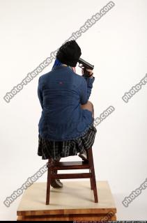 dolores-sitting-pistol-pose