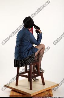 dolores-sitting-pistol-pose