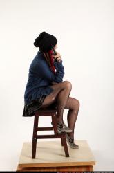 dolores-sitting-pistol-pose