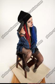dolores-sitting-pistol-pose