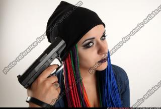 dolores-sitting-pistol-pose