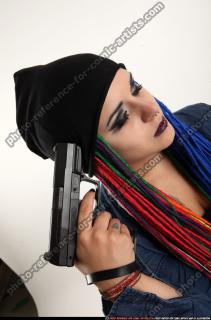 dolores-sitting-pistol-pose