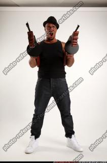 Ron-tommyguns-pose2