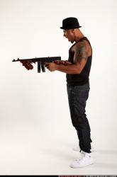Ron-tommyguns-pose2