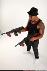 Ron-tommyguns-pose2