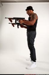Ron-tommyguns-pose2