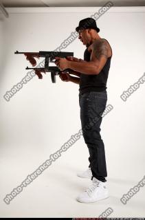 Ron-tommyguns-pose2