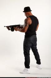 Ron-tommyguns-pose2