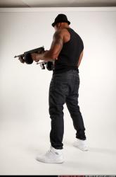Ron-tommyguns-pose2