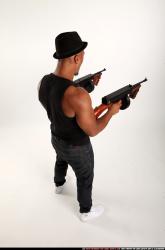 Ron-tommyguns-pose2