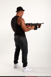 Ron-tommyguns-pose2