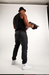 Ron-tommyguns-pose2
