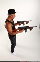 Ron-tommyguns-pose2