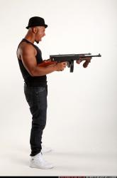 Ron-tommyguns-pose2