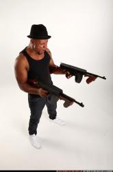 Ron-tommyguns-pose2