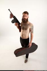 oscar-tommygun-case-pose