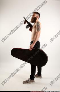 oscar-tommygun-case-pose