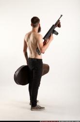 oscar-tommygun-case-pose