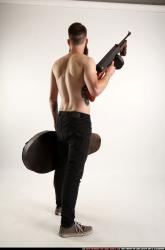 oscar-tommygun-case-pose