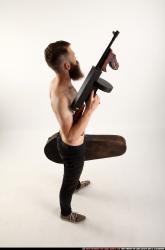 oscar-tommygun-case-pose