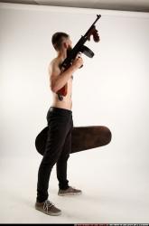 oscar-tommygun-case-pose