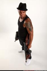 Ron-tommyguns-pose3