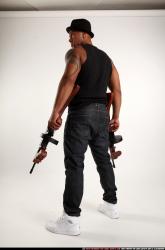 Ron-tommyguns-pose3