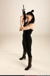 claudia-standing-m4a1-pose