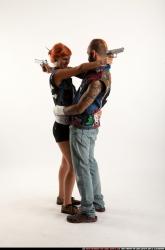 Edgar-pistols-pose4-cross-shooting
